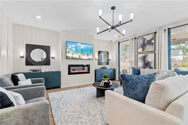 a living room with furniture and a large window