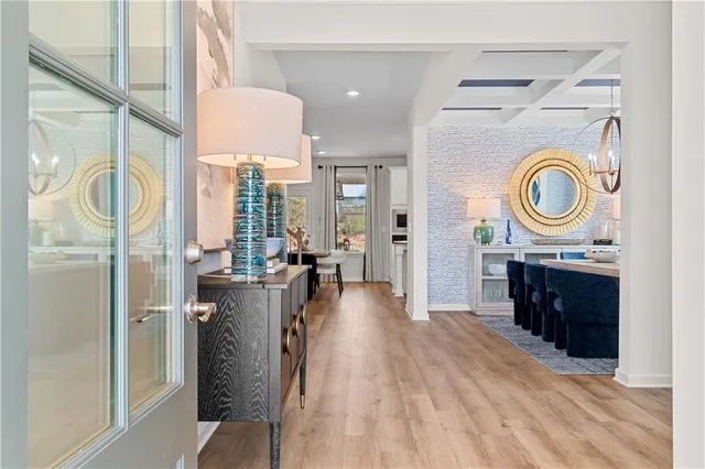 a dining room with furniture and window