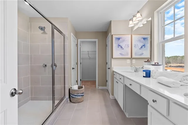 a bathroom with a double vanity sink mirror and double