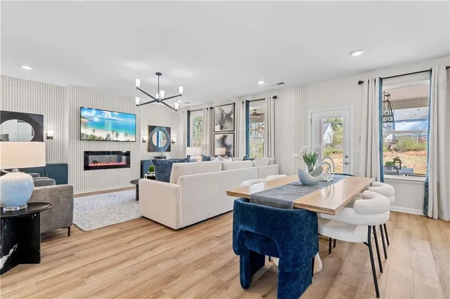 a kitchen with a sink stainless steel appliances and white cabinets