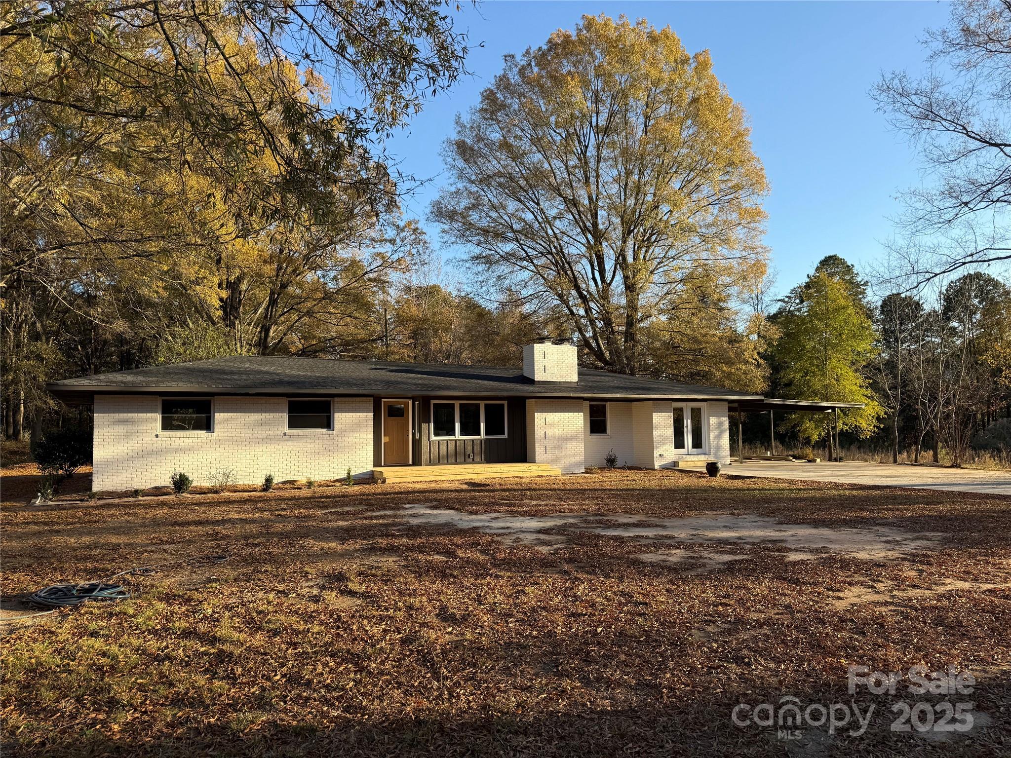 a front view of a house with yard