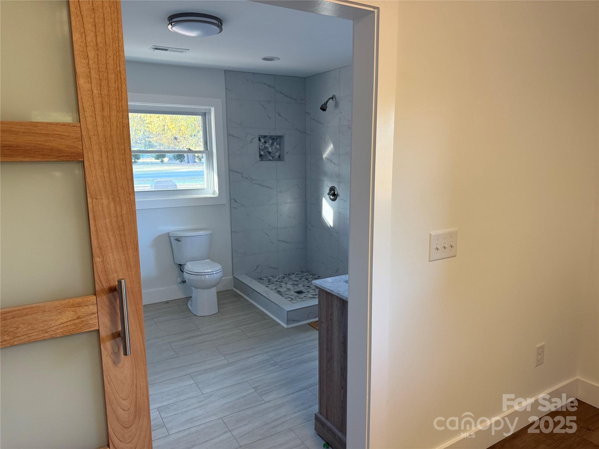 1208 Mariposa Road Stanley, NC 28164 - Photo 14 of 22 a bathroom with a toilet sink