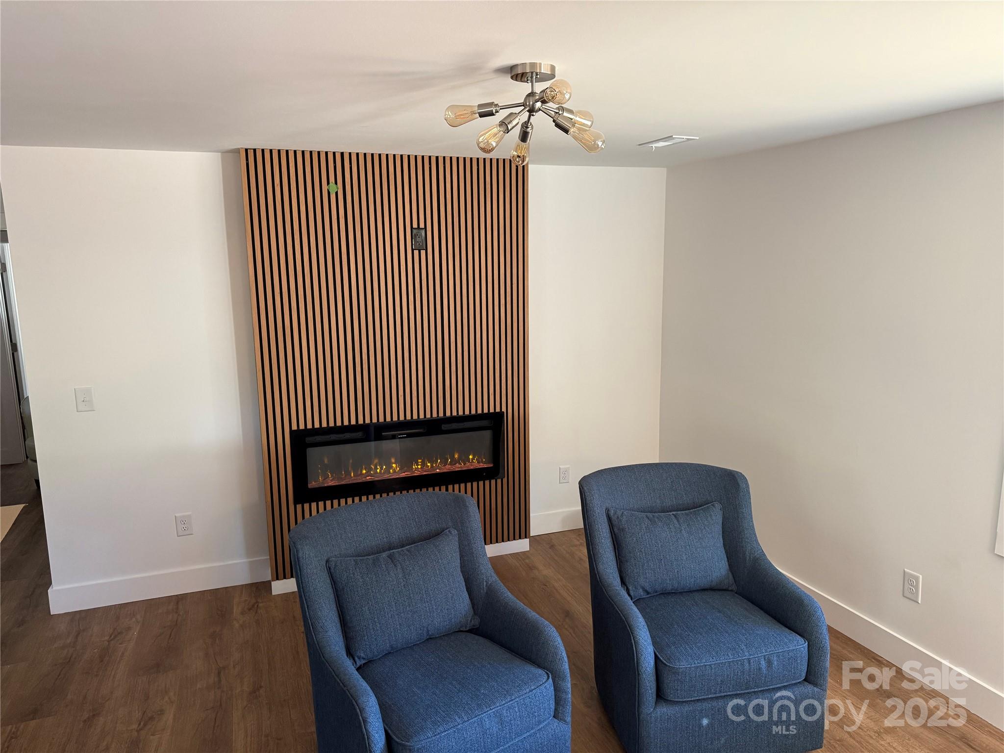 1208 Mariposa Road Stanley, NC 28164 - Photo 20 of 22 a hallway with chairs and wooden floor