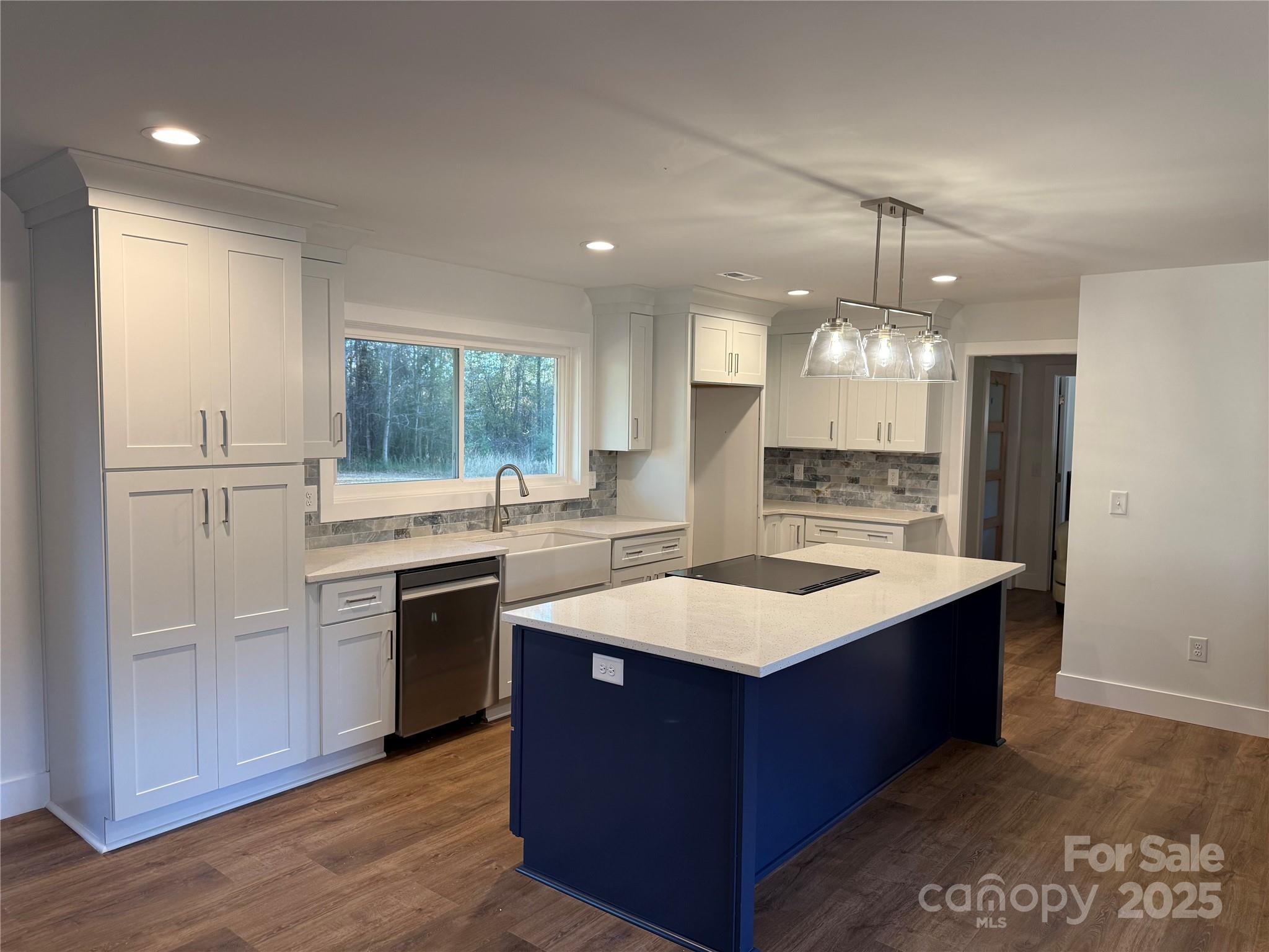 1208 Mariposa Road Stanley, NC 28164 - Photo 6 of 22 a kitchen with a sink stove and refrigerator