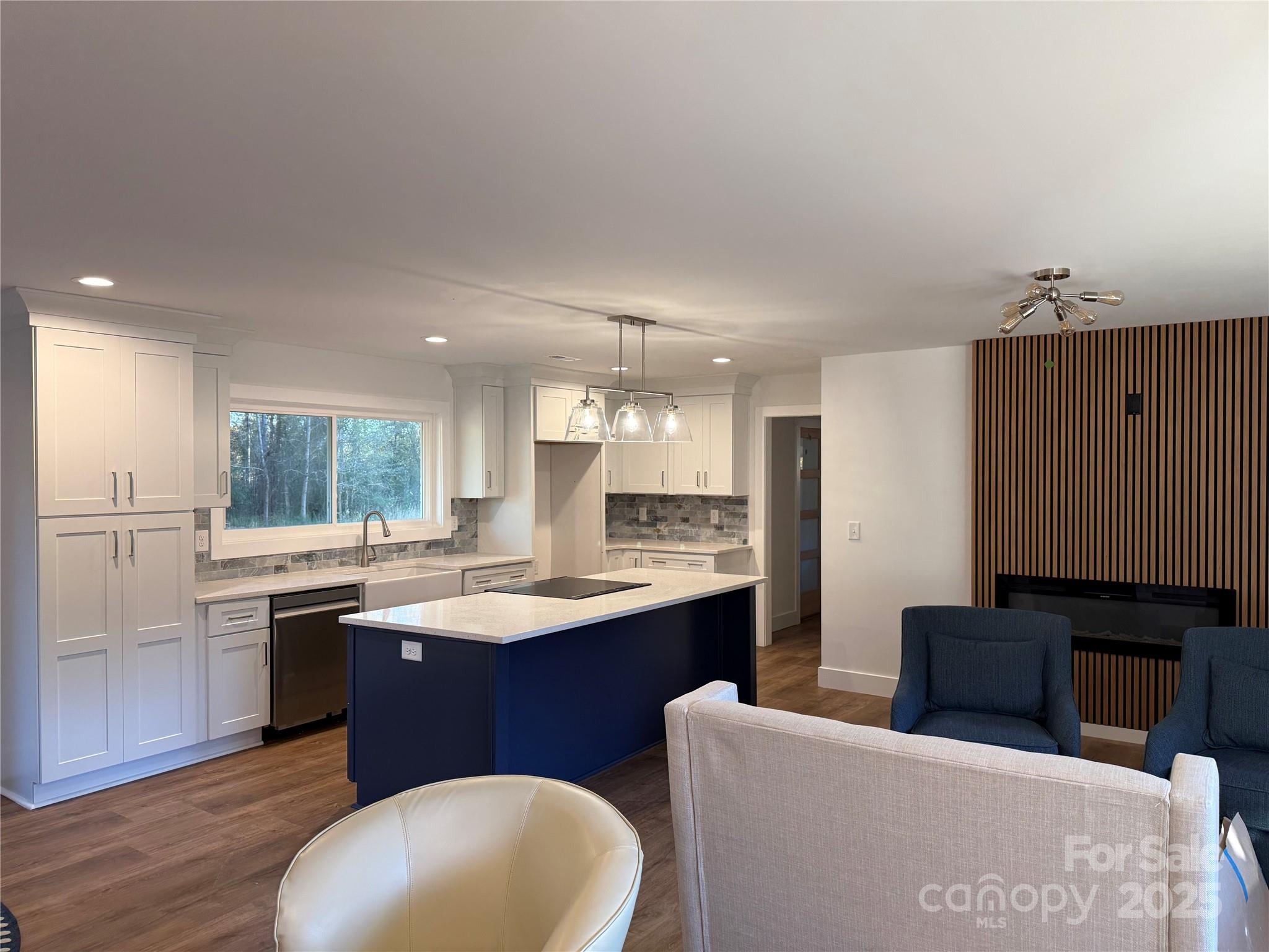 1208 Mariposa Road Stanley, NC 28164 - Photo 7 of 22 a kitchen with stainless steel appliances granite countertop a sink and a refrigerator