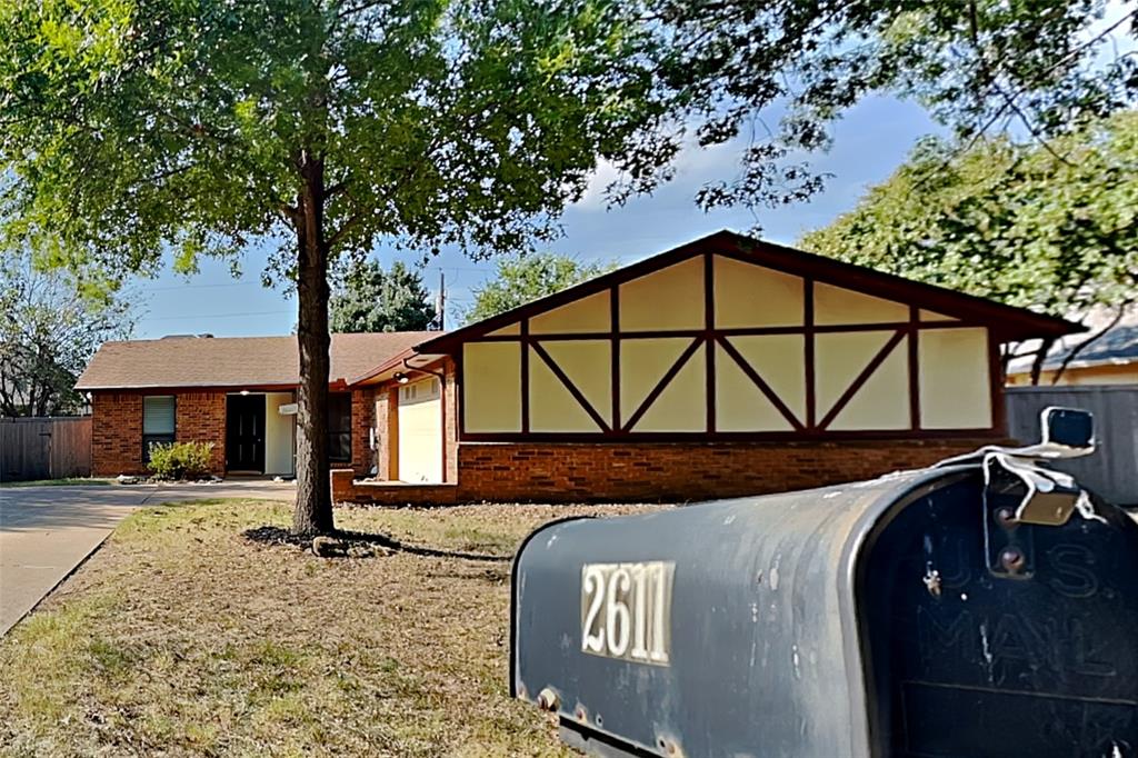 2611 Valley View Drive Corinth, TX 76210 - Photo 1 of 18 a front view of a house with parking area