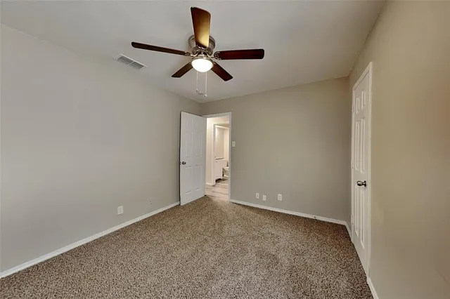 a view of room with ceiling fan