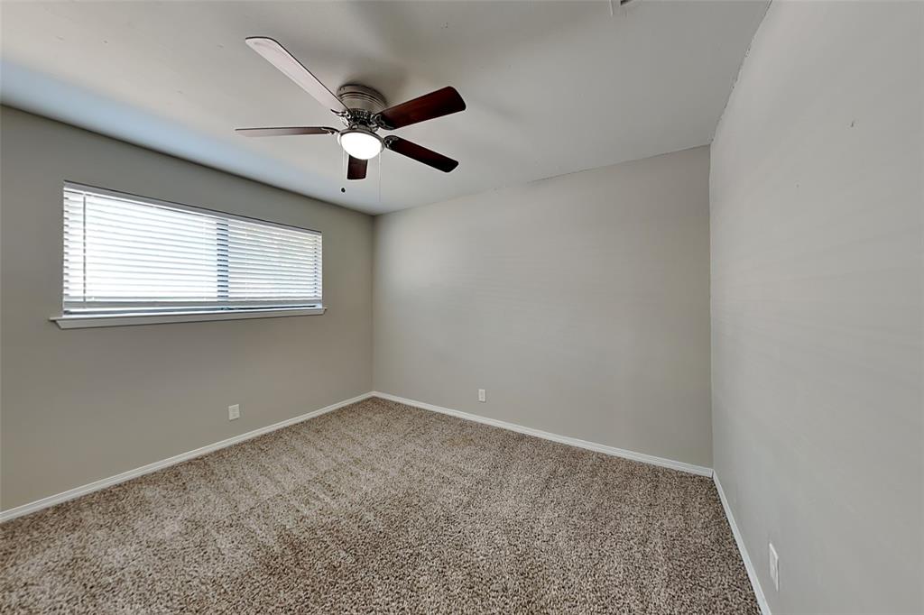 2611 Valley View Drive Corinth, TX 76210 - Photo 14 of 18 an empty room with a ceiling fan and window