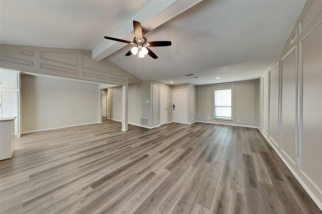 2611 Valley View Drive Corinth, TX 76210 - Photo 3 of 18 a view of empty room with window and wooden floor