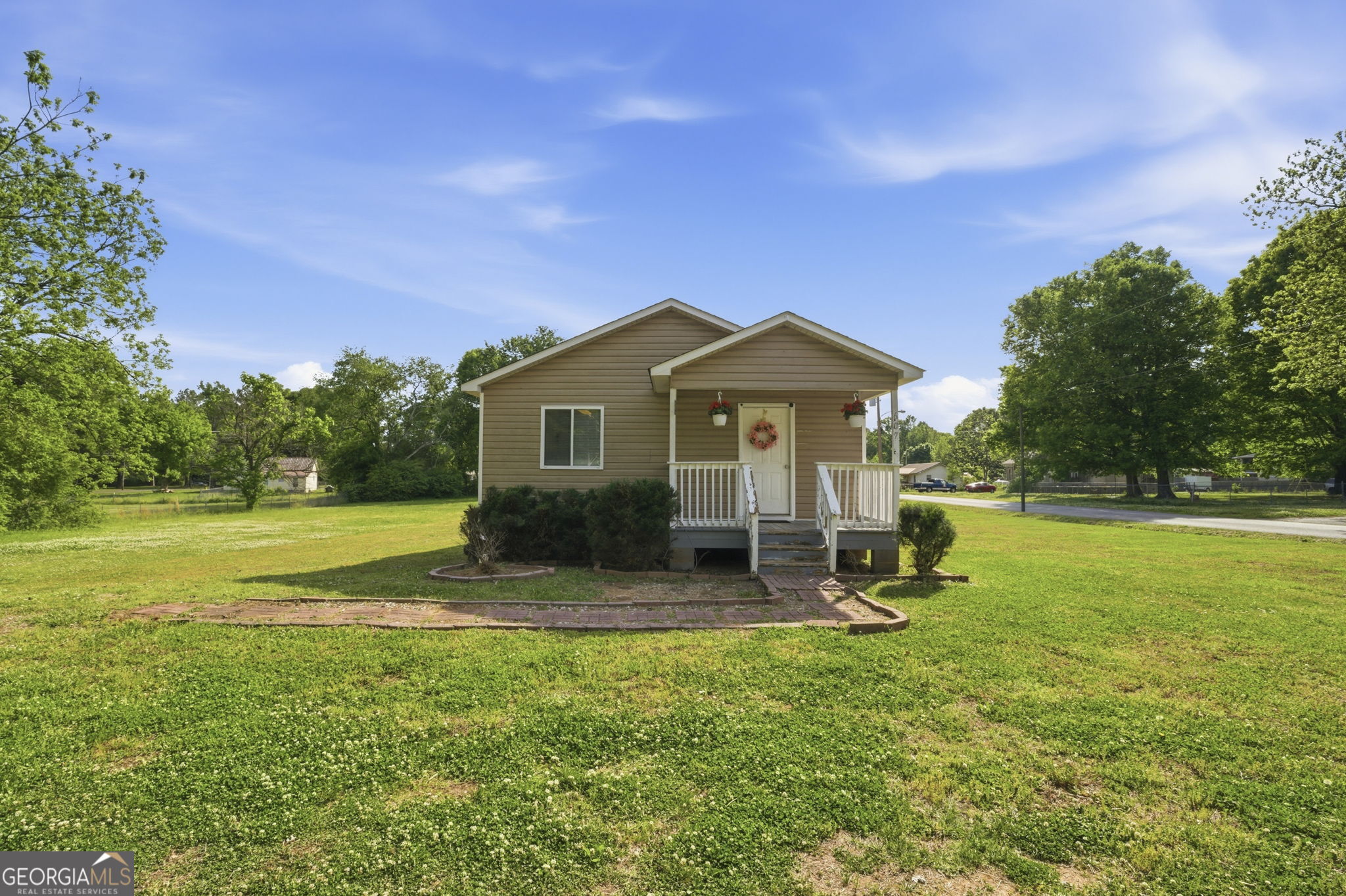 a front view of a house with garden