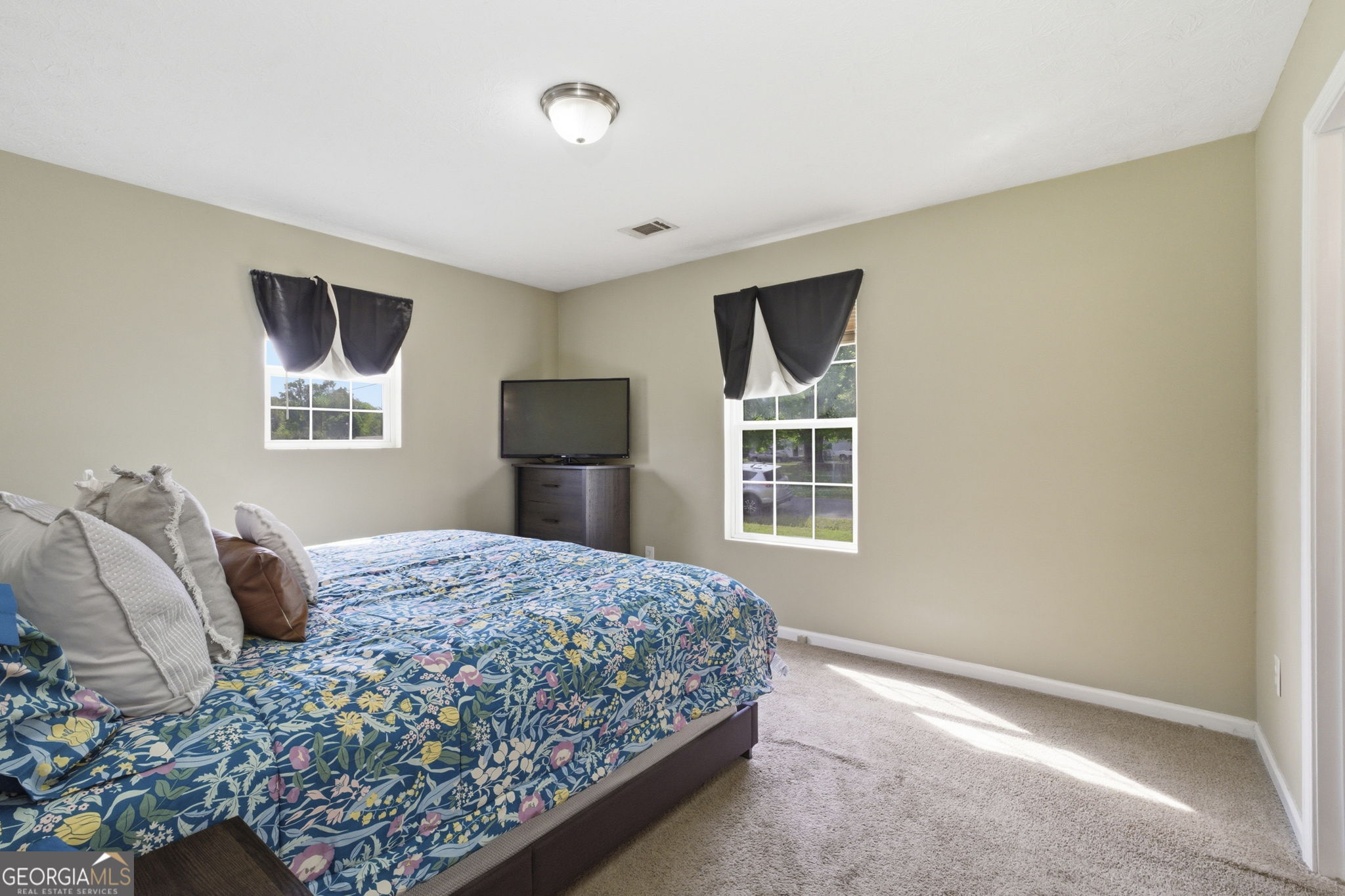 607 Thornton Street LaFayette, GA 30728 - Photo 17 of 25 a bedroom with a bed and a window