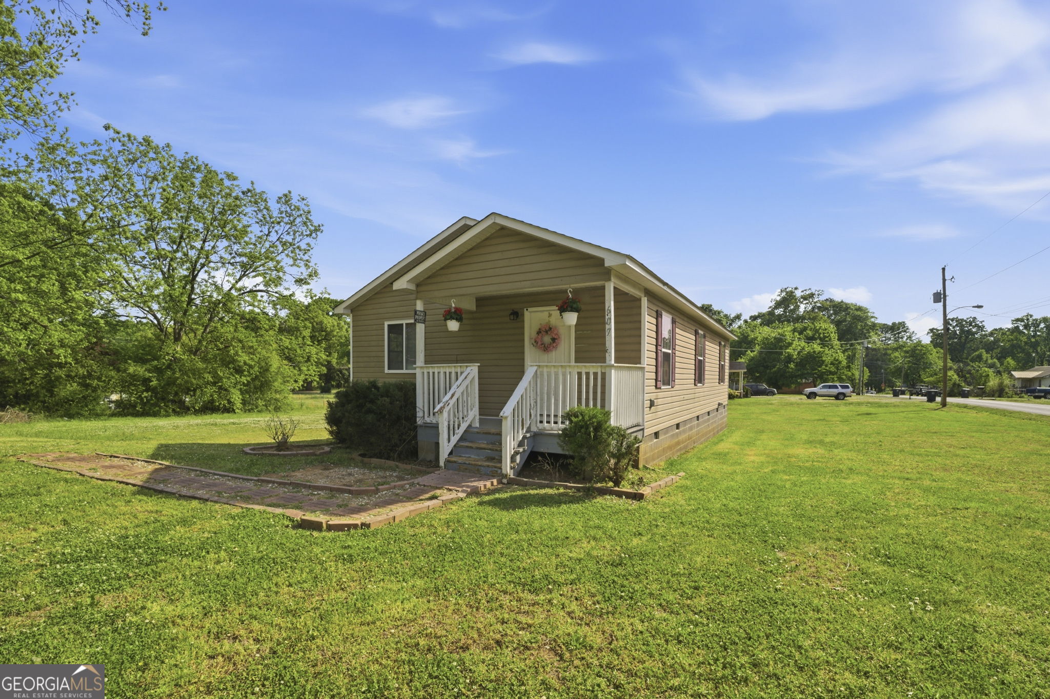 607 Thornton Street LaFayette, GA 30728 - Photo 21 of 25 a front view of a house with a yard