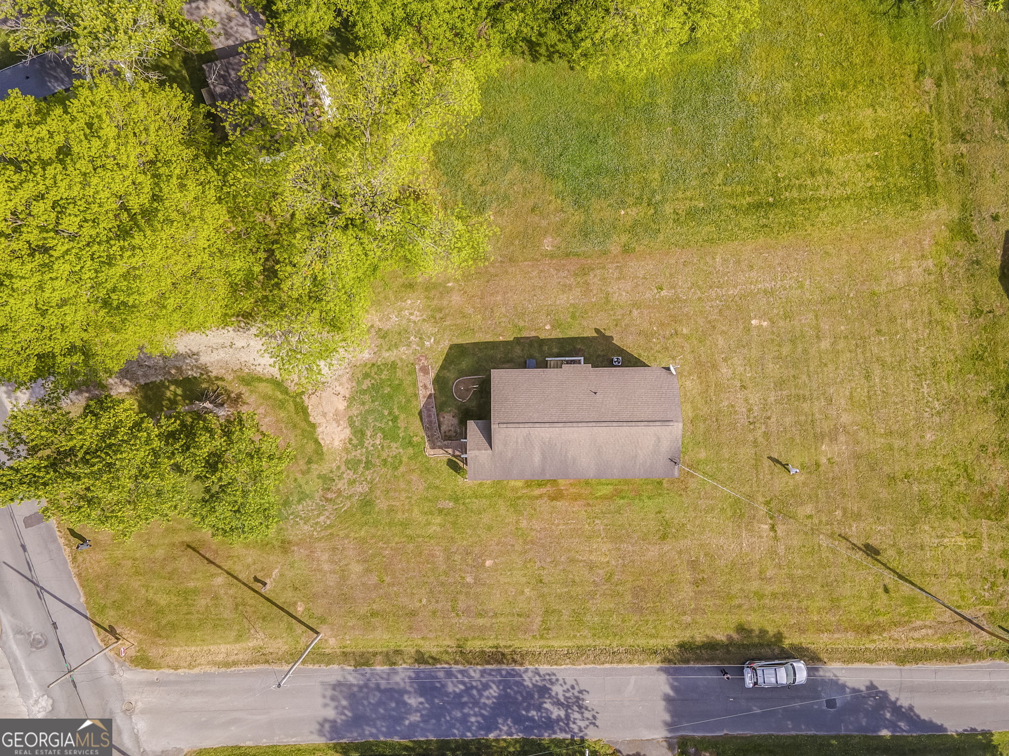 607 Thornton Street LaFayette, GA 30728 - Photo 23 of 25 a building with a trees in the background