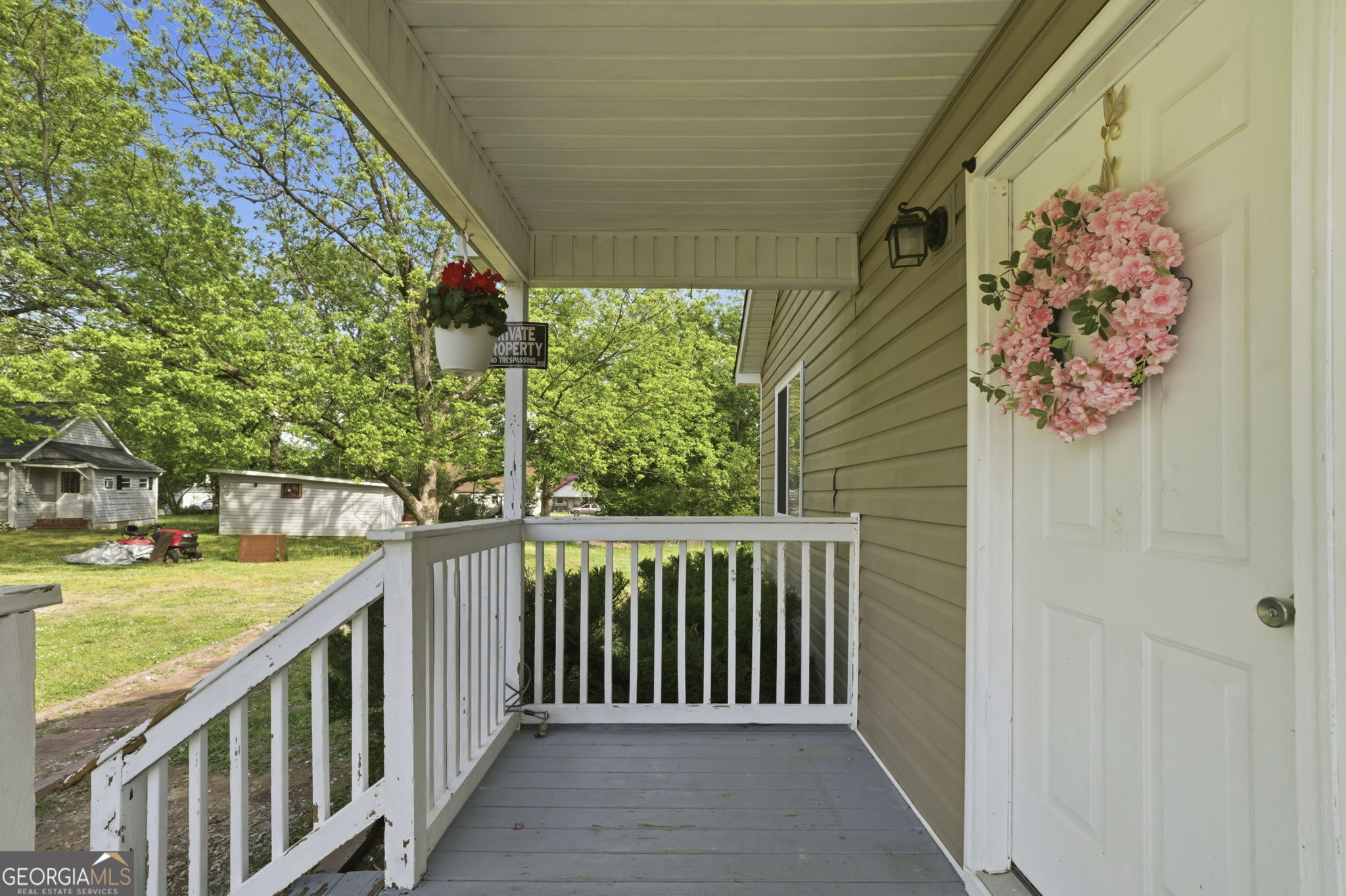 607 Thornton Street LaFayette, GA 30728 - Photo 3 of 25 a view of a porch with wooden floor and fence