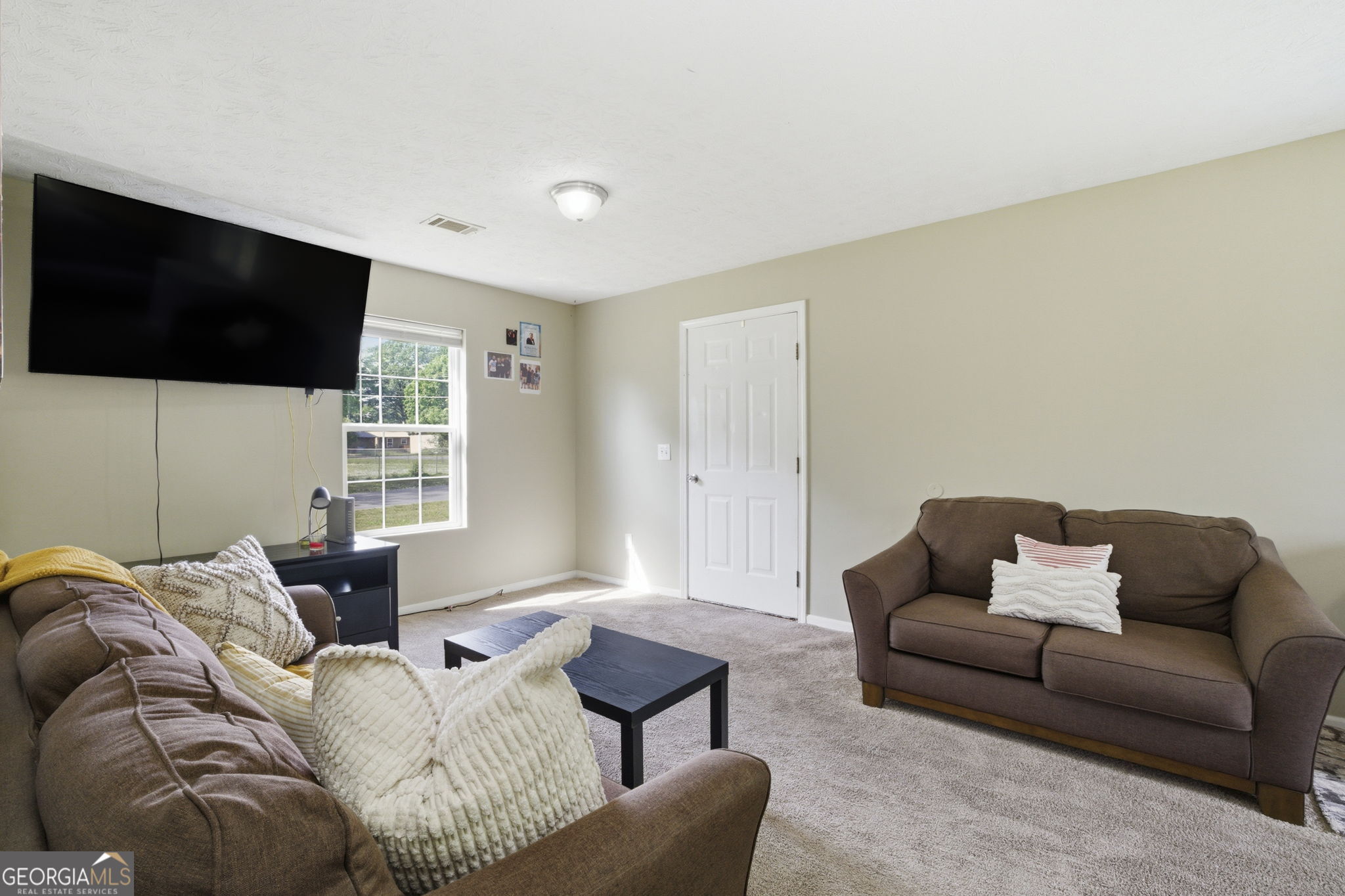607 Thornton Street LaFayette, GA 30728 - Photo 5 of 25 a living room with furniture and a flat screen tv
