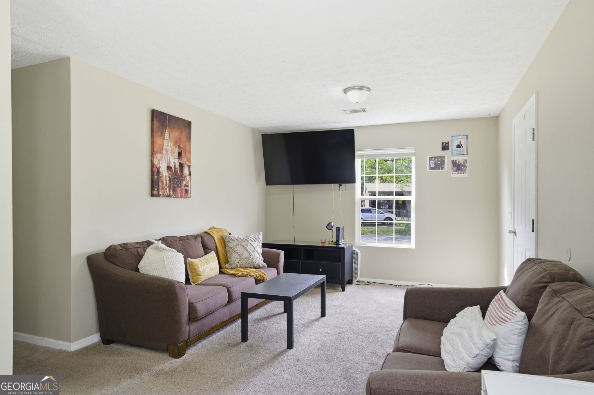 607 Thornton Street LaFayette, GA 30728 - Photo 6 of 25 a living room with furniture and a flat screen tv