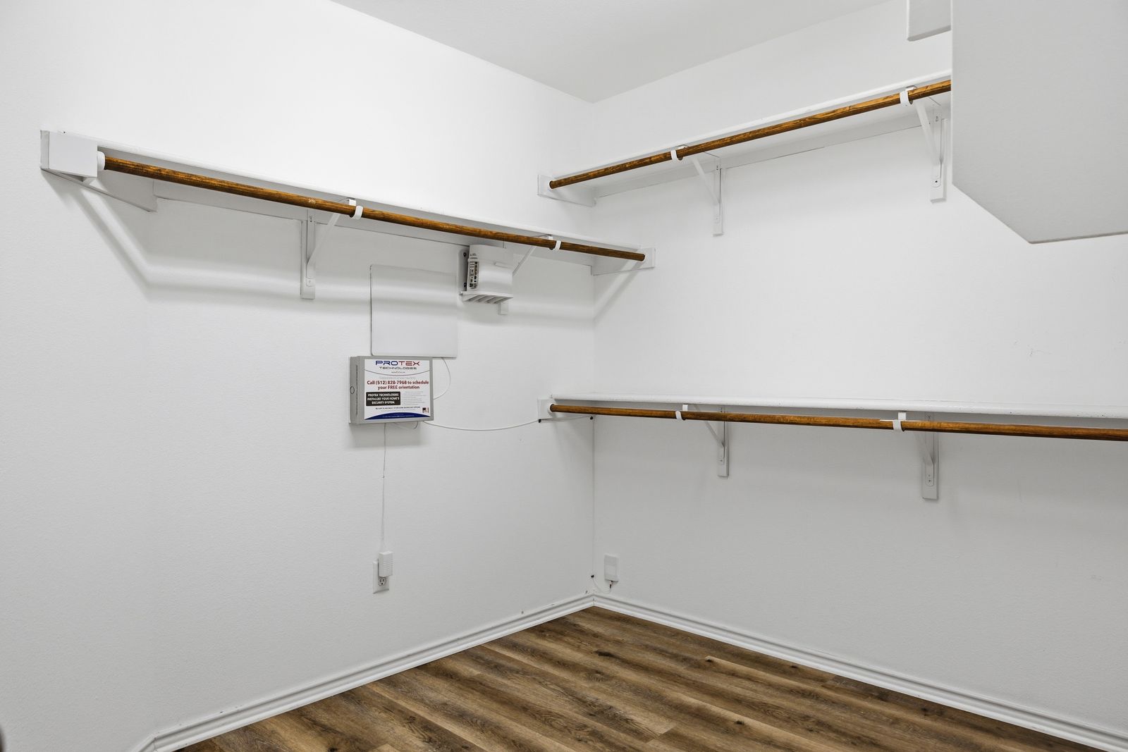 8012 Izetta Lane Austin, TX 78744 - Photo 13 of 27 a view of a room with racks on the wall