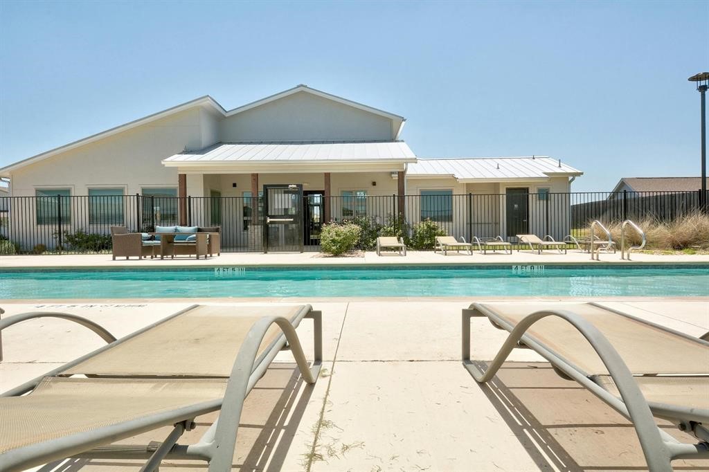 8012 Izetta Lane Austin, TX 78744 - Photo 25 of 27 a view of a swimming pool with a patio