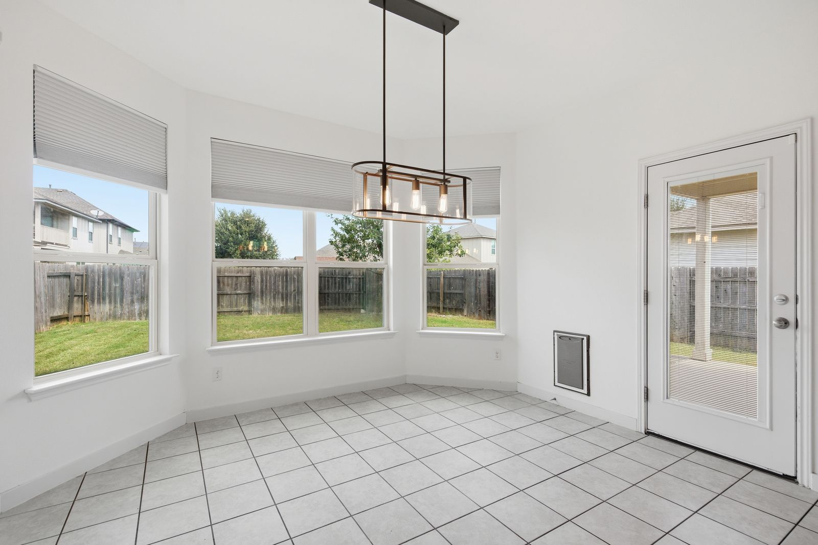 8012 Izetta Lane Austin, TX 78744 - Photo 6 of 27 a view of an empty room with windows