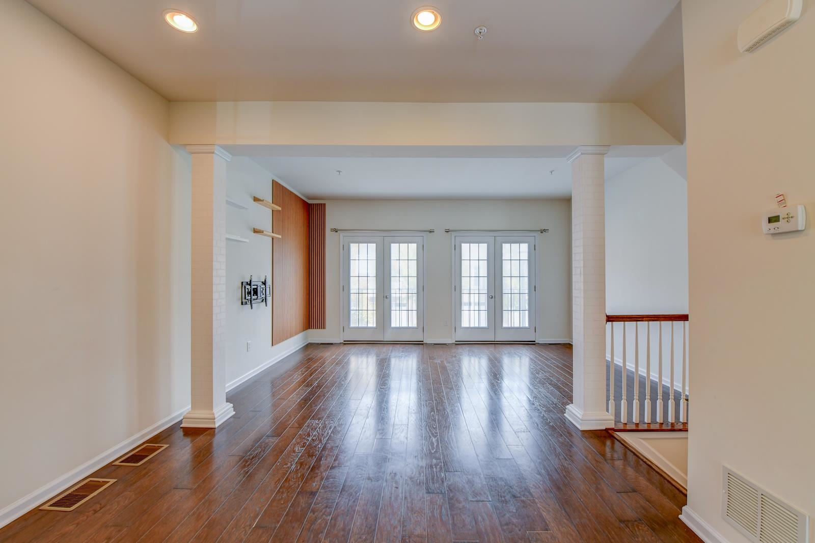 23 Creekside Court, Unit 23 Secaucus, NJ 07094 - Photo 15 of 38 wooden floor in an empty room with a window
