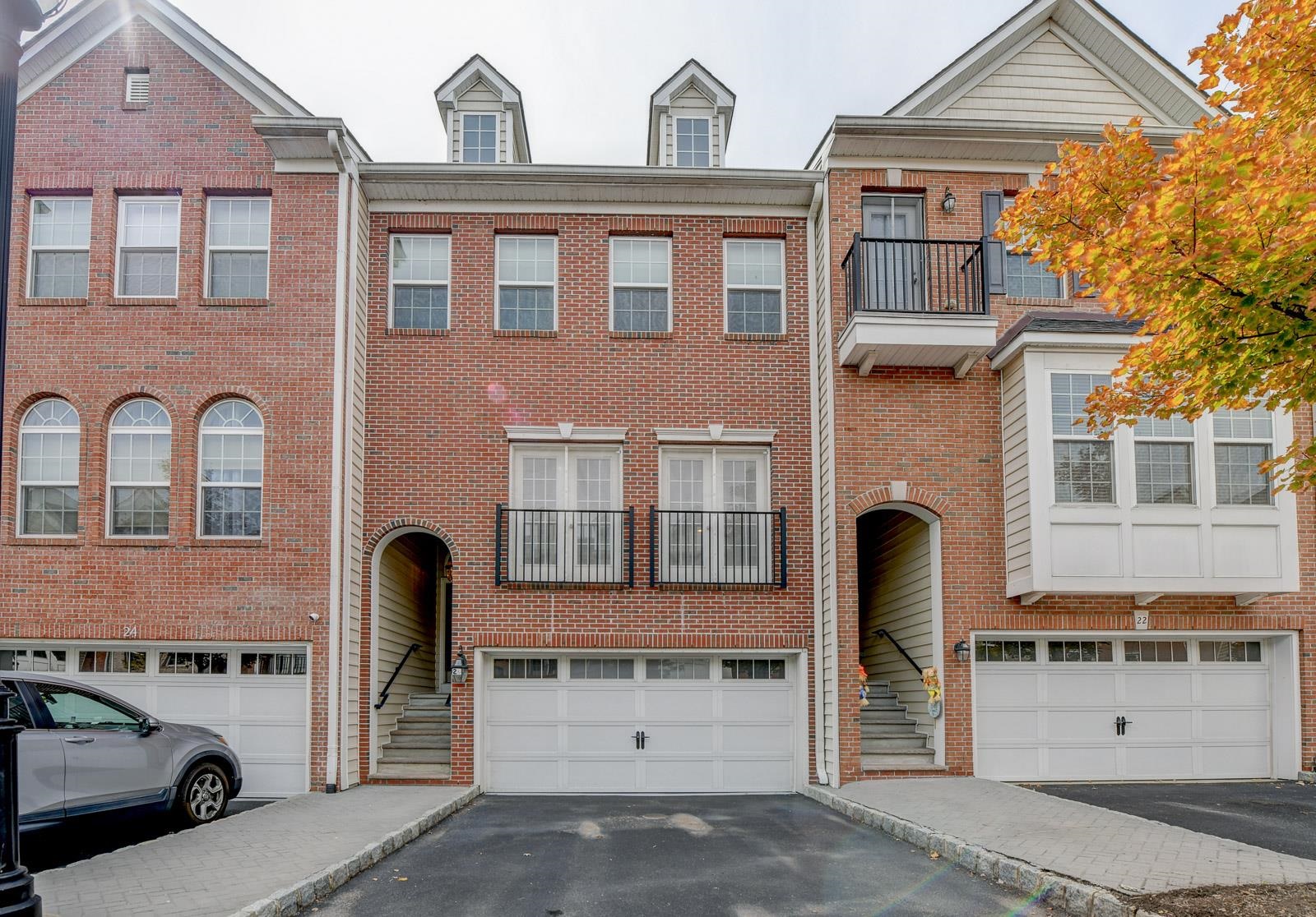 23 Creekside Court, Unit 23 Secaucus, NJ 07094 - Photo 21 of 38 a front view of a building with parking area
