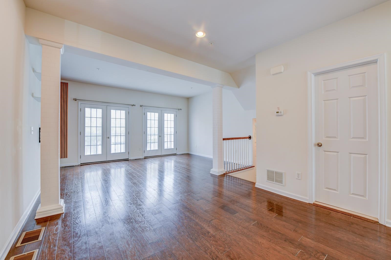23 Creekside Court, Unit 23 Secaucus, NJ 07094 - Photo 22 of 38 a view of empty room with wooden floor and fan