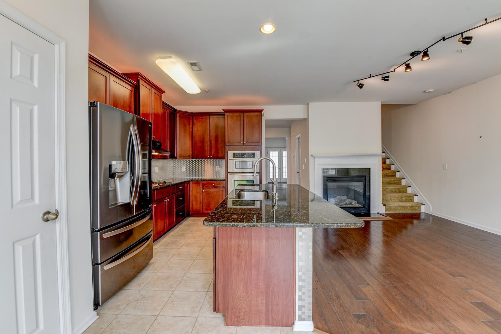 23 Creekside Court, Unit 23 Secaucus, NJ 07094 - Photo 25 of 38 a kitchen with stainless steel appliances granite countertop a refrigerator and a stove