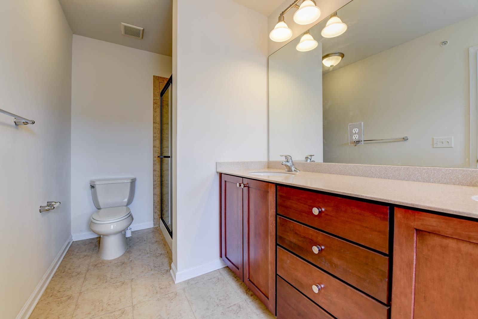 23 Creekside Court, Unit 23 Secaucus, NJ 07094 - Photo 30 of 38 a bathroom with a sink a toilet and a mirror