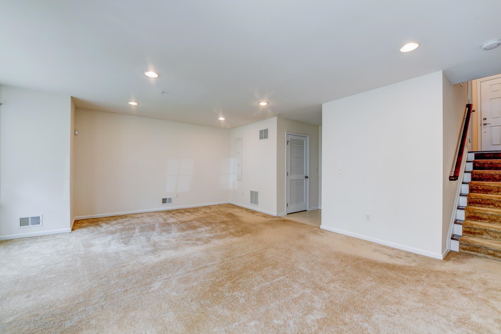 23 Creekside Court, Unit 23 Secaucus, NJ 07094 - Photo 9 of 38 a view of an empty room with stairs and a walk in closet