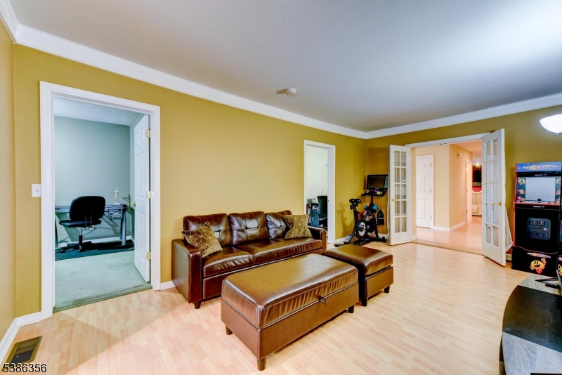 481 Terrill Road Fanwood, NJ 07023 - Photo 12 of 31 a living room with furniture and a flat screen tv