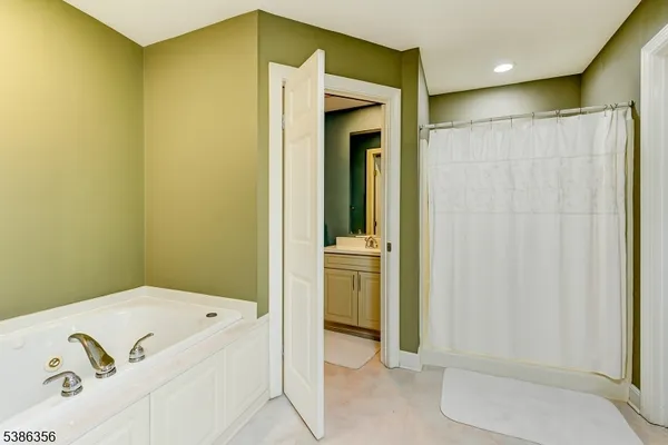 a bathroom with a tub and sink