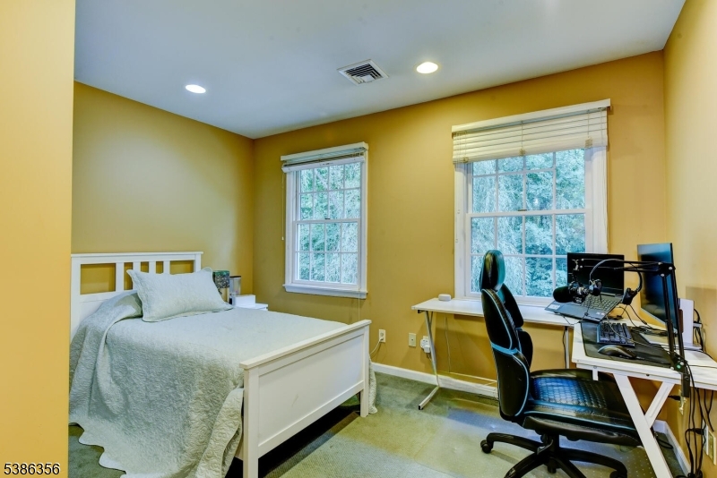 481 Terrill Road Fanwood, NJ 07023 - Photo 23 of 31 a bed room with a bed and a chair