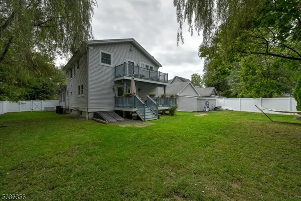 a view of backyard with small cabin