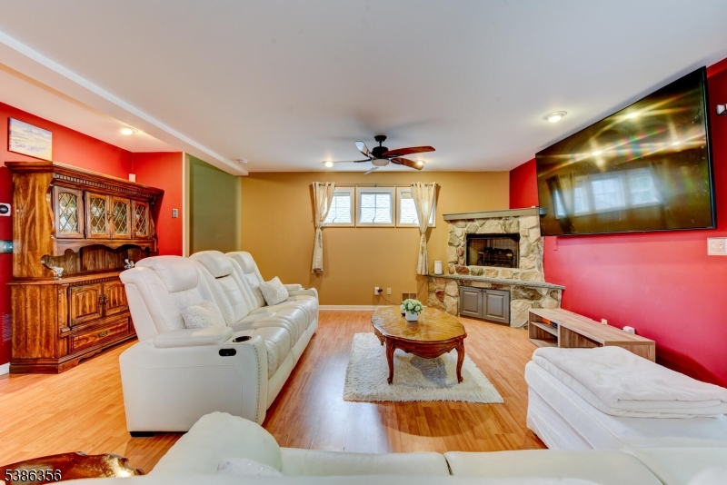 481 Terrill Road Fanwood, NJ 07023 - Photo 5 of 31 a living room with furniture a flat screen tv and kitchen view