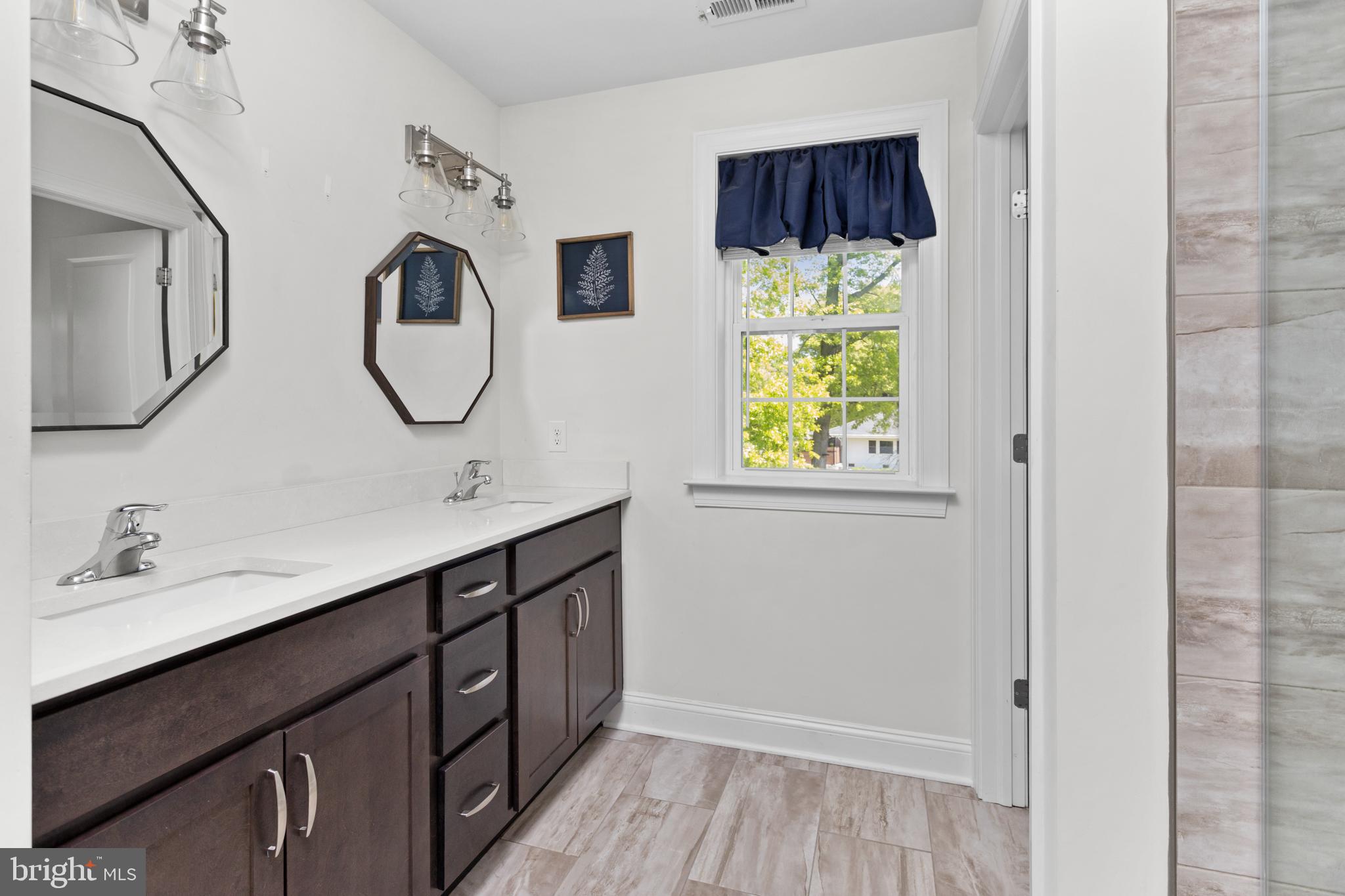 6 Buck Ln Mount Mount Laurel, NJ 08054 - Photo 28 of 49 a bathroom with a double vanity sink and a mirror