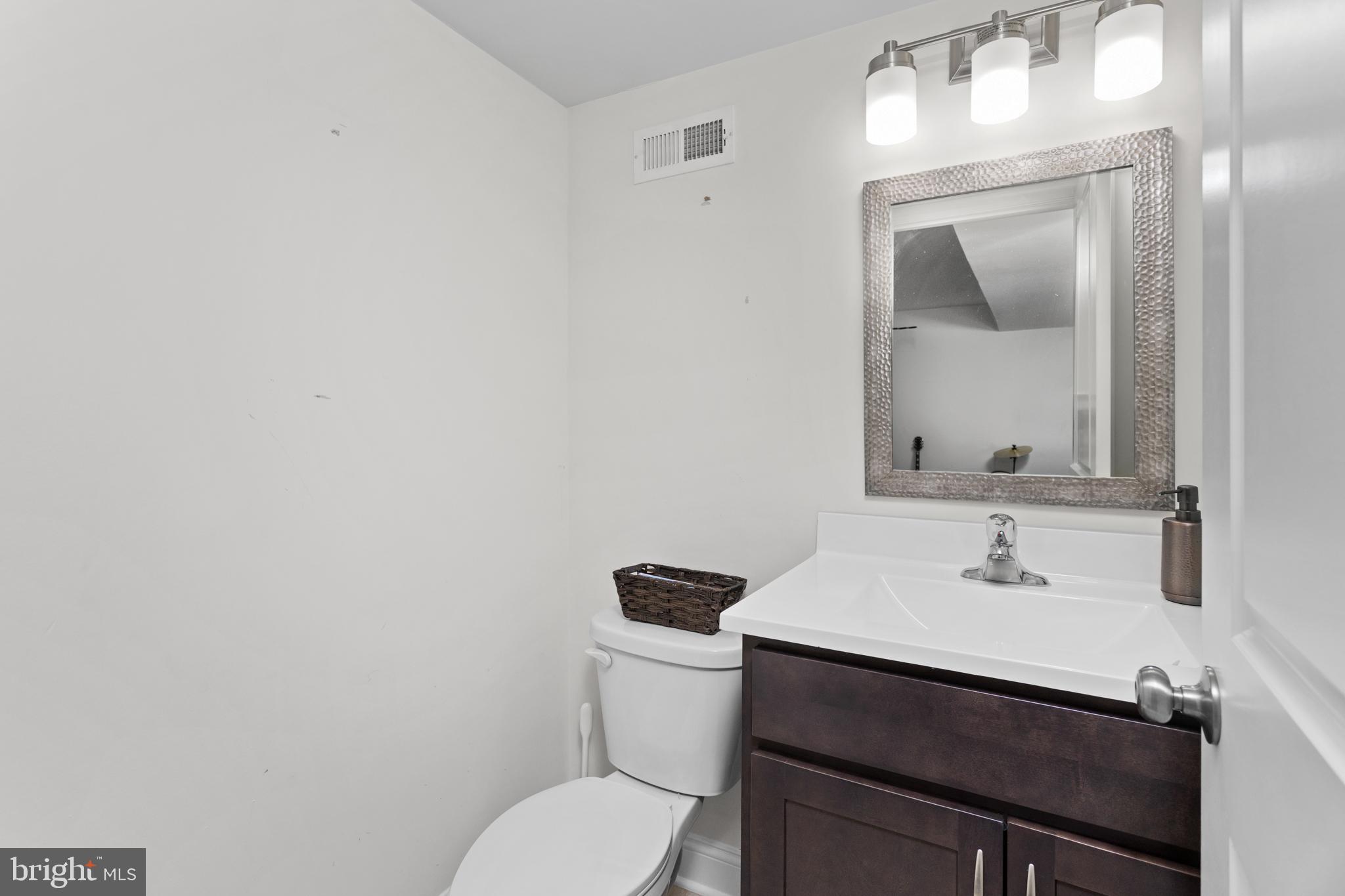 6 Buck Ln Mount Mount Laurel, NJ 08054 - Photo 40 of 49 a bathroom with a toilet sink and mirror