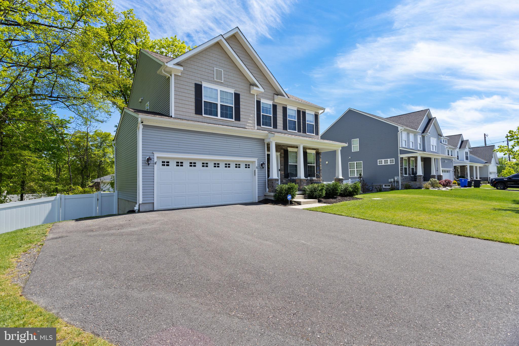 6 Buck Ln Mount Mount Laurel, NJ 08054 - Photo 4 of 49 a front view of a house with a yard and garage