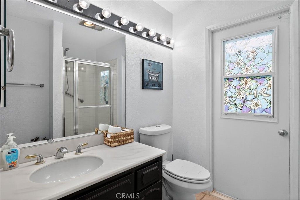 610 Violeta Drive Palm Springs, CA 92262 - Photo 14 of 25 a bathroom with a sink a toilet and shower