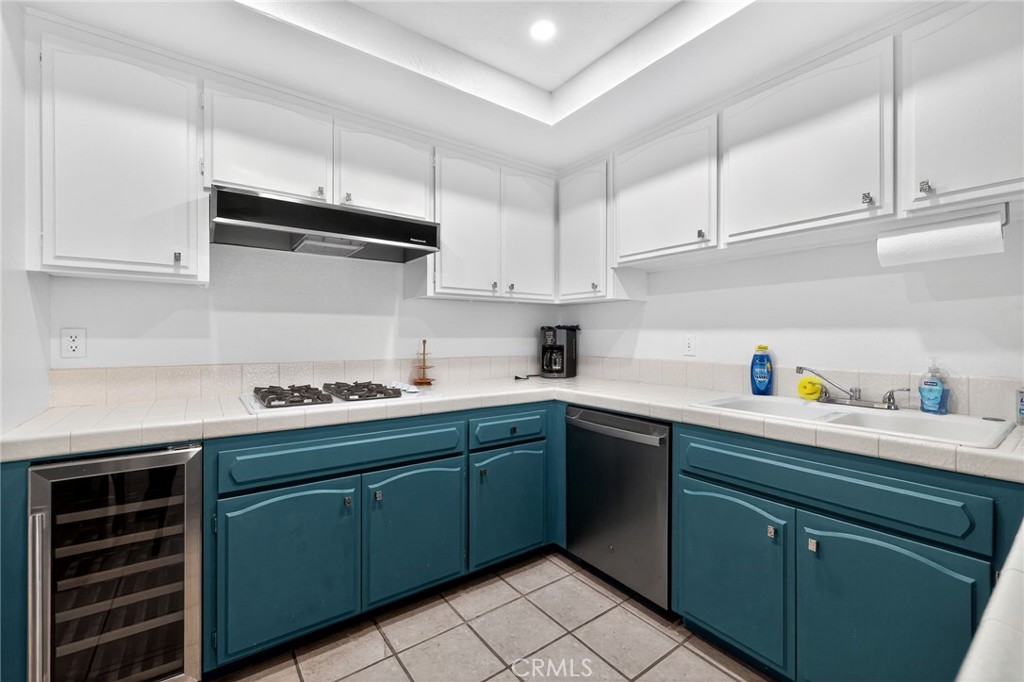 610 Violeta Drive Palm Springs, CA 92262 - Photo 17 of 25 a kitchen with cabinets and white appliances