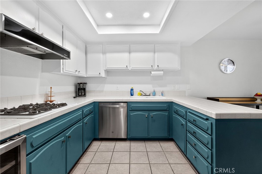 610 Violeta Drive Palm Springs, CA 92262 - Photo 18 of 25 a kitchen with a cabinets and white appliances