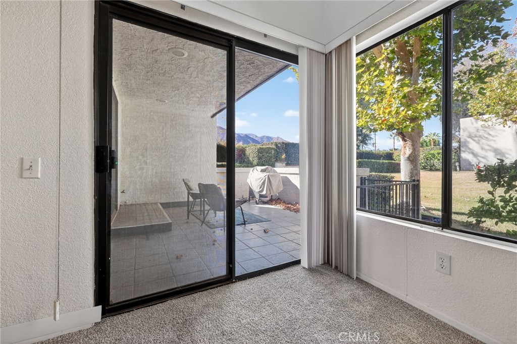 610 Violeta Drive Palm Springs, CA 92262 - Photo 4 of 25 a view of a room that has a large window