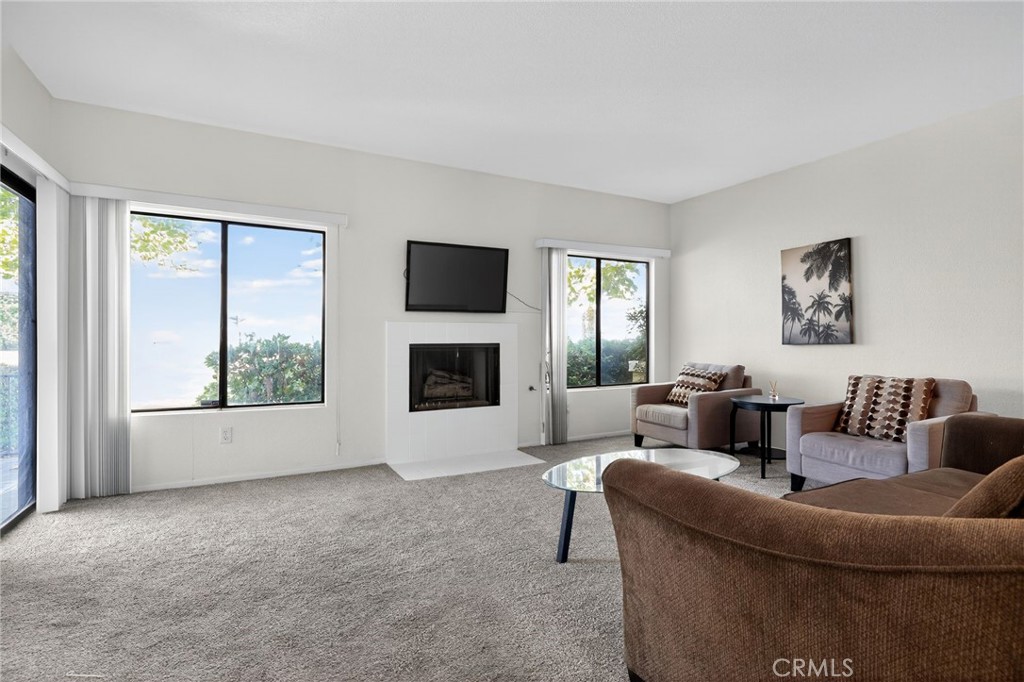 610 Violeta Drive Palm Springs, CA 92262 - Photo 5 of 25 a living room with furniture and a flat screen tv