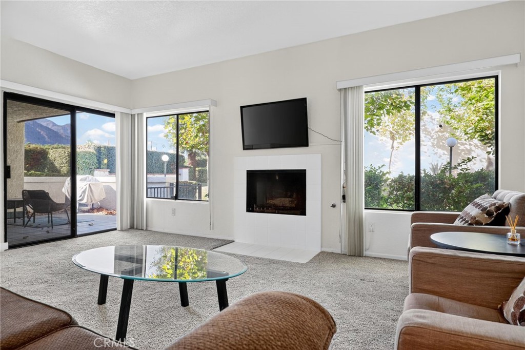 610 Violeta Drive Palm Springs, CA 92262 - Photo 6 of 25 a living room with furniture tv and a large window