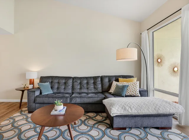 a bedroom with bed and a night stand