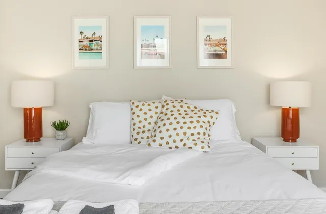 a bed room with a bed and a chair