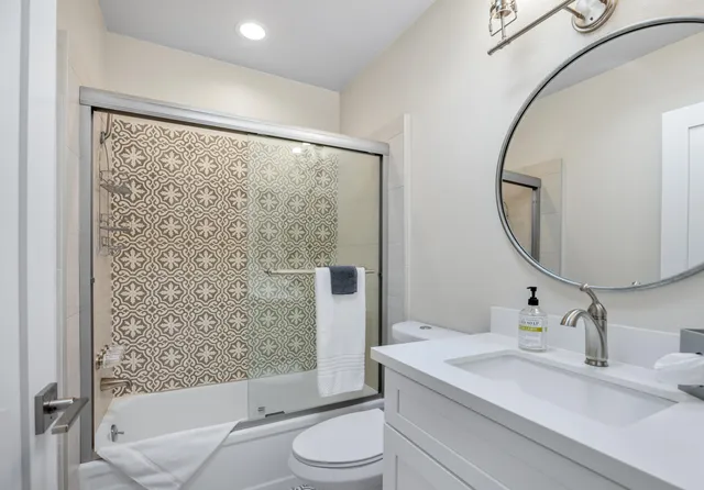 a bedroom with a bed a lamp and a window