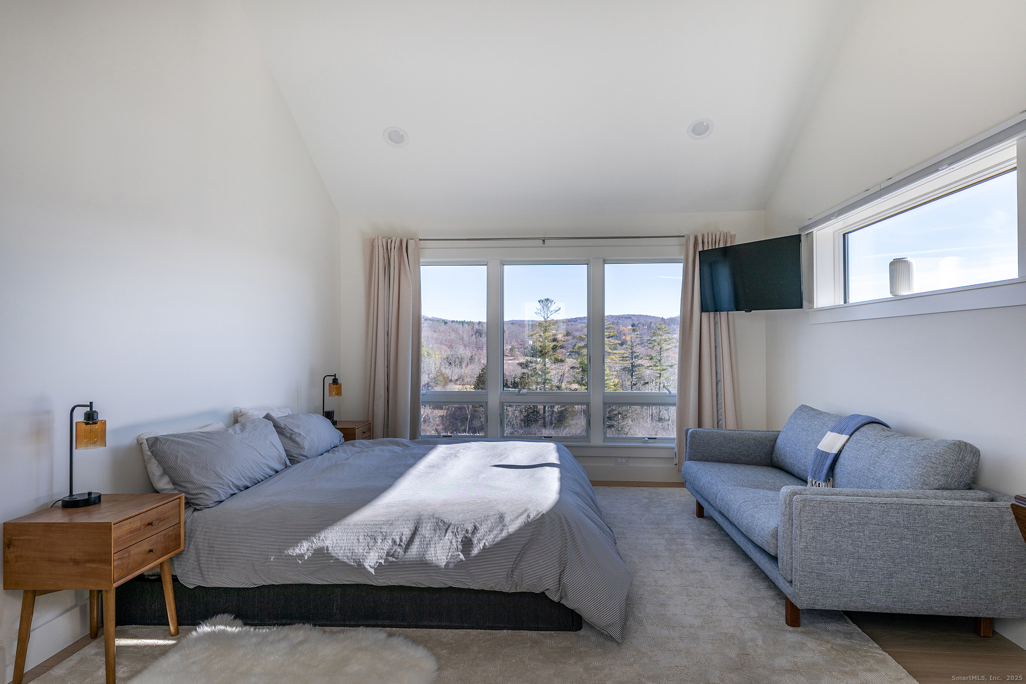 202 Sharon Valley Road Sharon, CT 06069 - Photo 12 of 19 a spacious bedroom with a bed and glass window