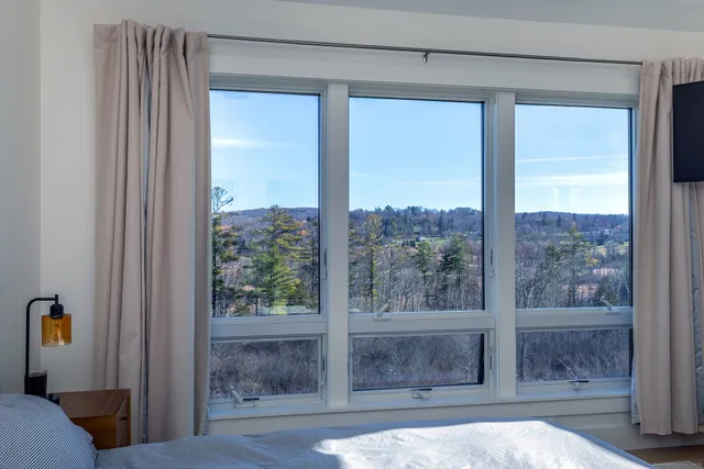 a living room with a couch and a window