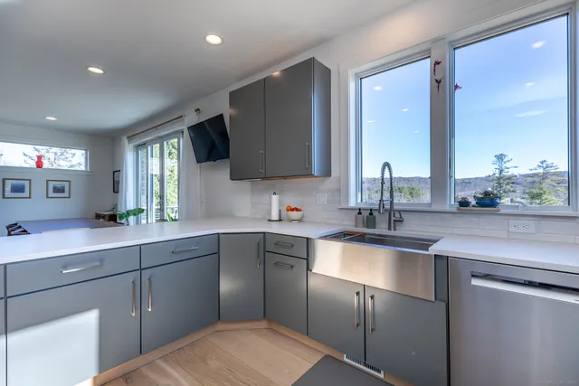 a kitchen with a sink and cabinets