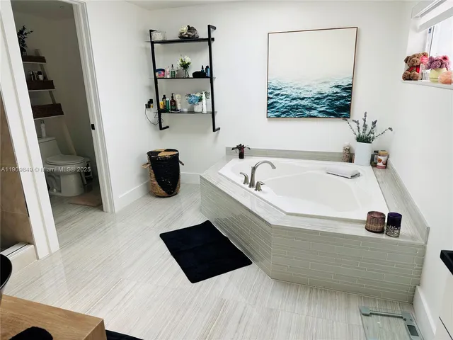 a bathroom with a bathtub and a sink